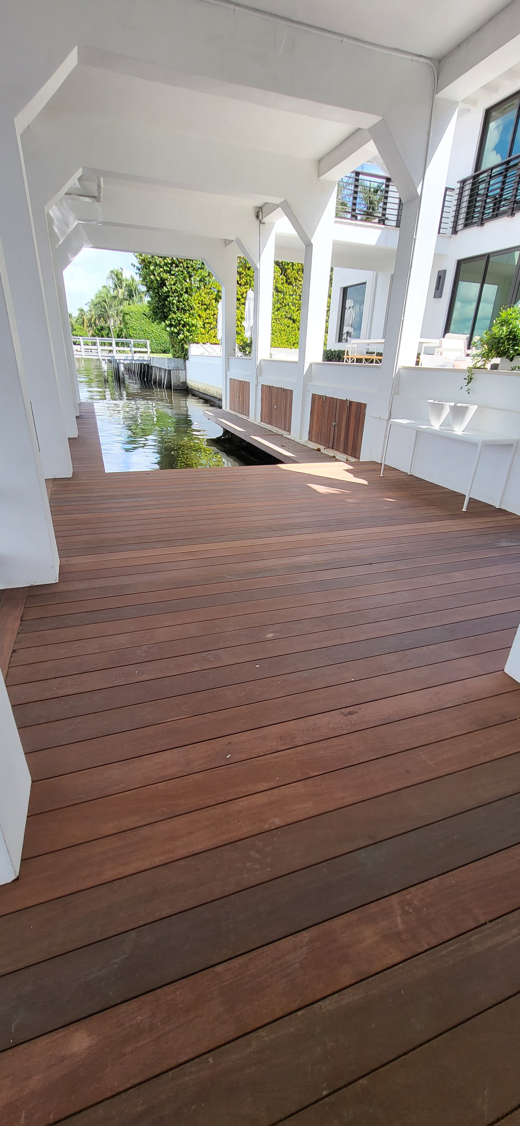 Waterfront hardwood deck with pergola — coastal South Florida