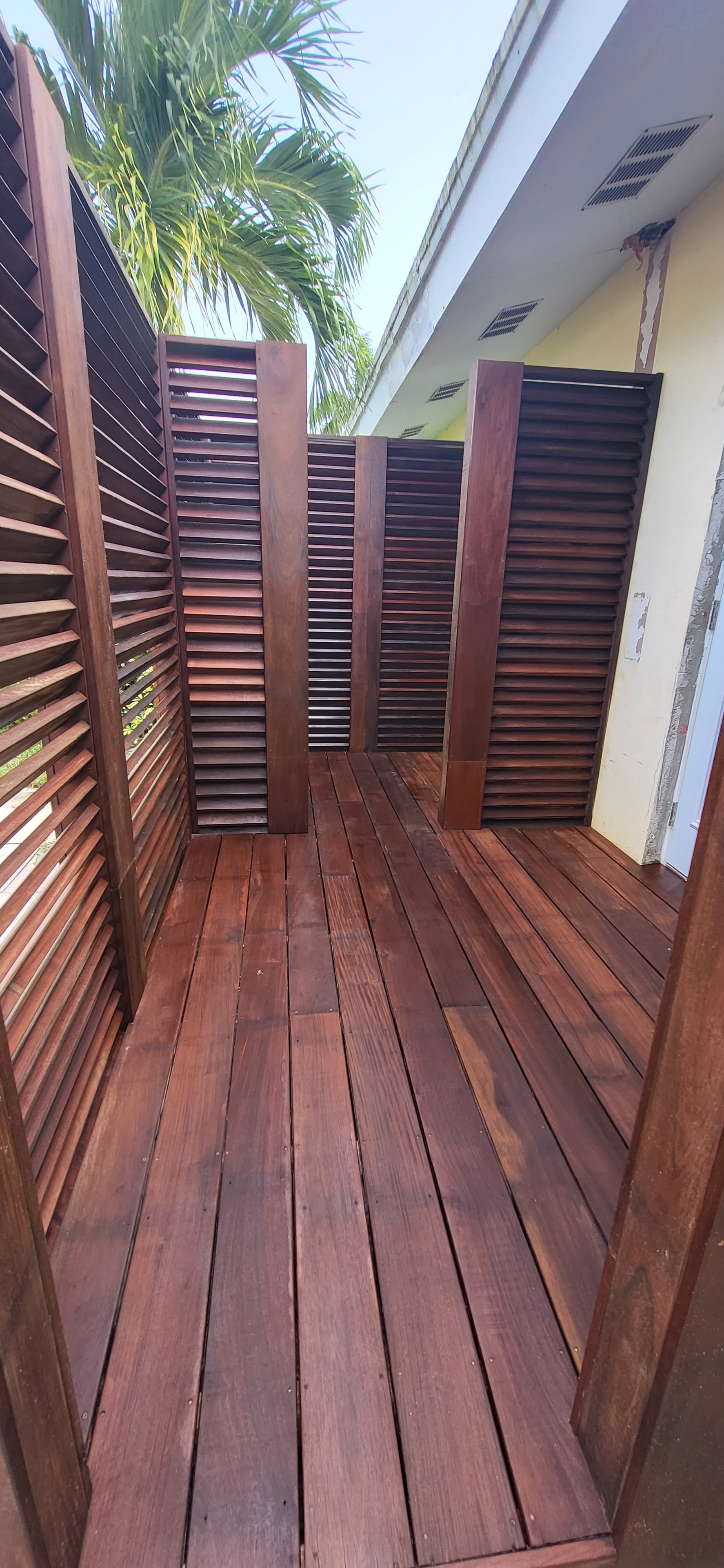 Hardwood deck with slatted privacy screens — deck refinishing project